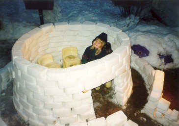 My daughter Maddy in the igloo we made xmas 98
